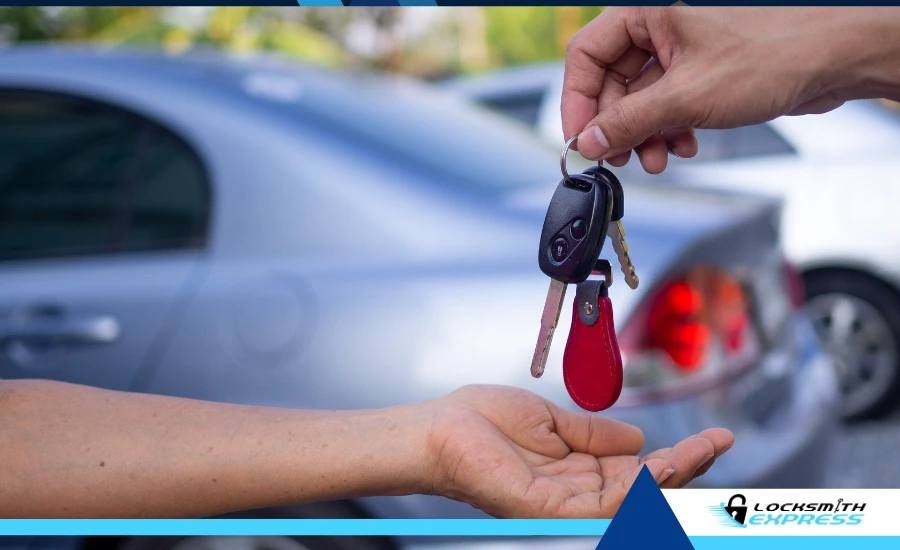 A happy customer receiving car keys from a locksmith.