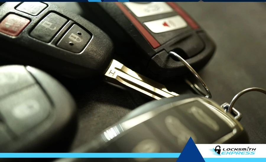 Broken car key next to a set of keys