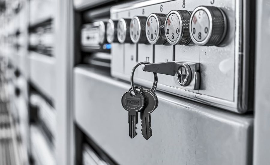 Locksmith extracting broken key from storage unit