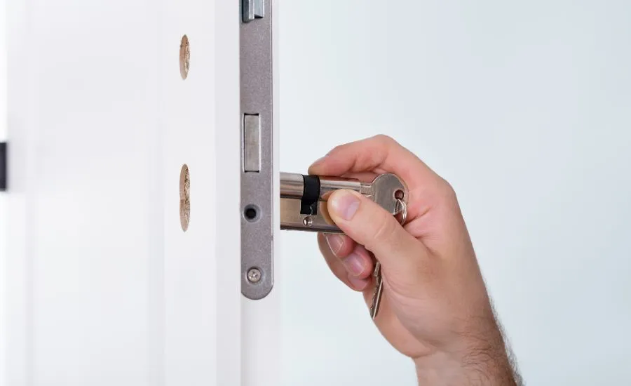 Locksmith Express technician changing a lock