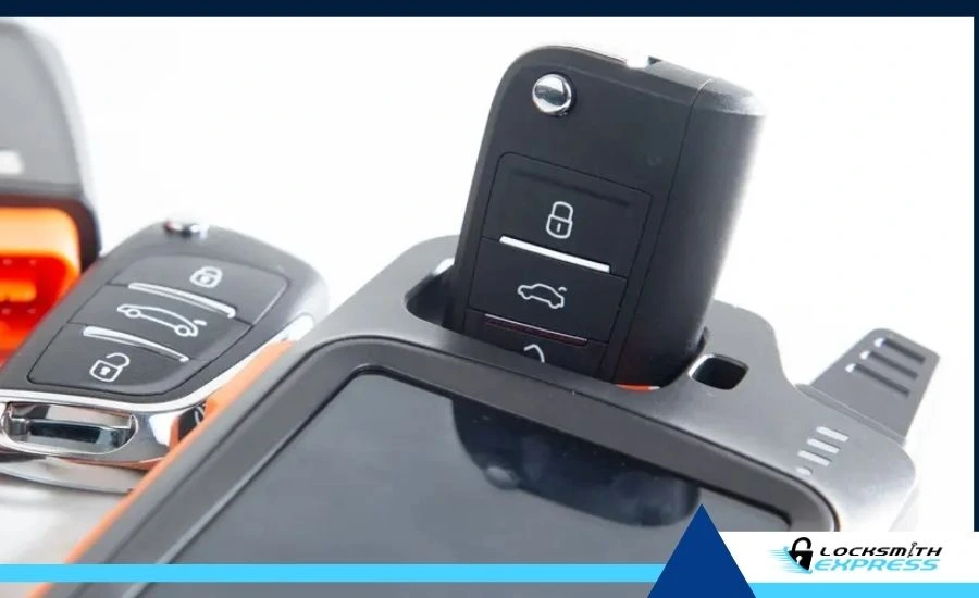 locksmith using tool to reprogram car key fob