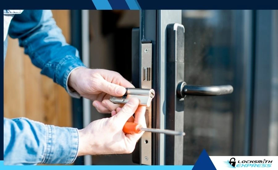Locksmith using tools to rekey or adjust a door lock