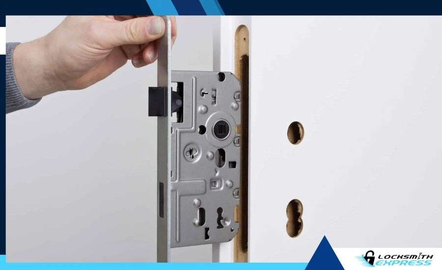 Technician installing a mortise lock on a commercial door