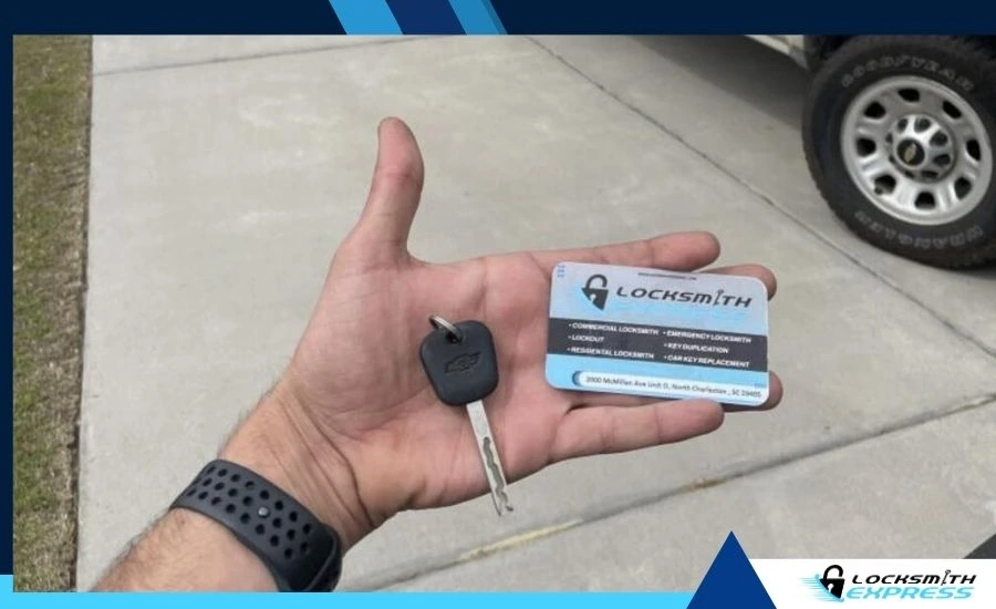 automotive locksmith holding or handing over a new car key
