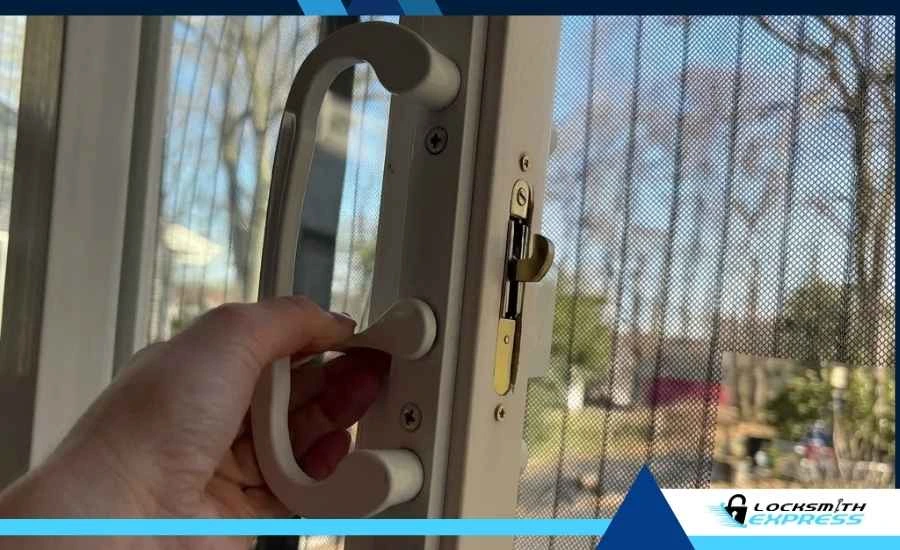 Close-up of a standard sliding door handle and hook latch mechanism